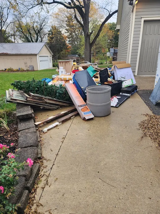 Dumpster being loaded with debris for Demolition Dumpster Rental in Columbia City